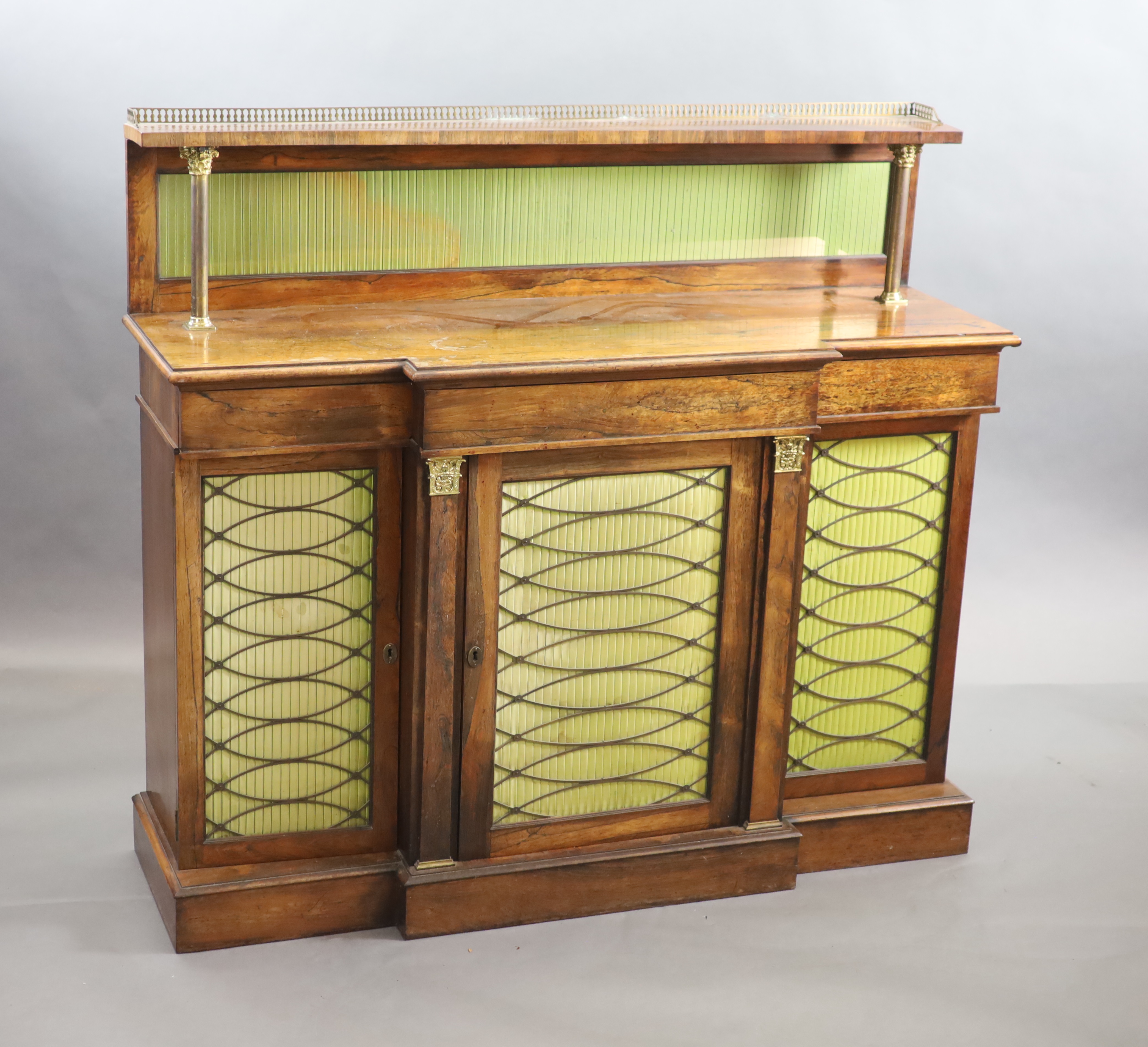 A Regency rosewood breakfront chiffonier, the raised back with three quarter gallery, W.136cm D.45cm H.123cm